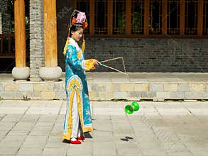 Manchurian girl juggling diabolo