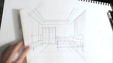The hand of an architect drawing a perspective of the bedroom