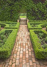 Brick pathway in formal garden