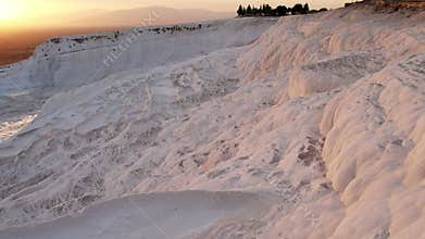 Aerial view of the travertines in Pamukkale in a beautiful sunset, Turkey. White limestone mineral formations. Turkish