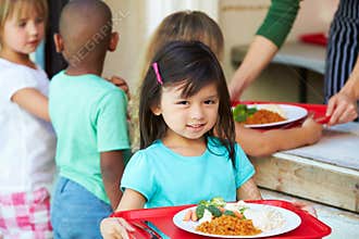 Elementary Pupils Collecting Healthy Lunch In Cafeteria