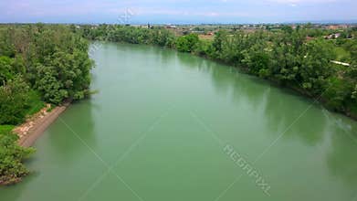 Aerial drone trip over Adige River, Italy