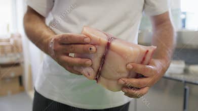 Chef Massages Swordfish Fillet Before Slicing It In A Restaurant