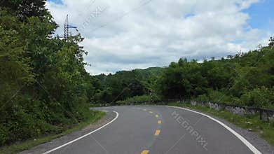 Backpacking trip by motorbike, hyper lapse landscape with winding moutain pass from motorcycle view when moving fast in high speed