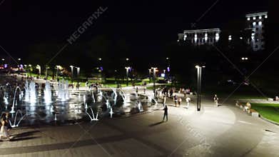 Aerial circle fountain pan on night Freedom Square