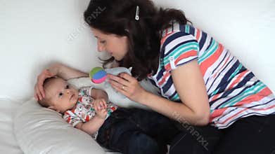 Mother playing with baby