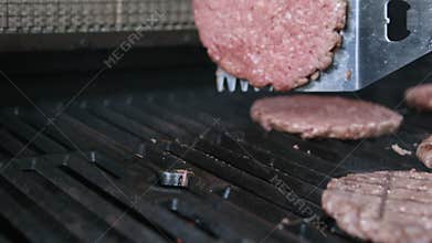 cooking beefsteak on the grill barbecue Grilled cutlets Hamburgers on the BBQ Grill