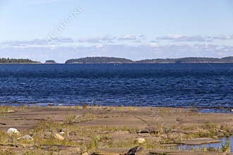 The azure waters of Lake Ladoga on a clear summer evening