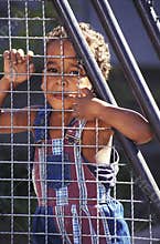 Brazilian child behind iron net