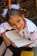 Beautiful little girl 7 years in embroidery books