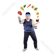 Fat man juggling healthy food