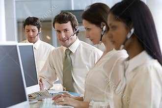 Young businessman in call center