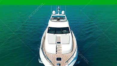 Luxury White Motor Yacht Sailing On Bright Emerald Green Water With Sunlight Reflection During Daytime Aerial View
