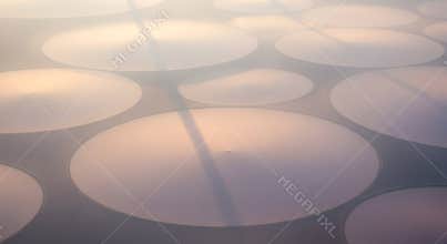 Abstract Aerial View of Circular Patterns at Sunrise