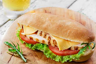 Sandwich with tomato and cheese grilled chicken