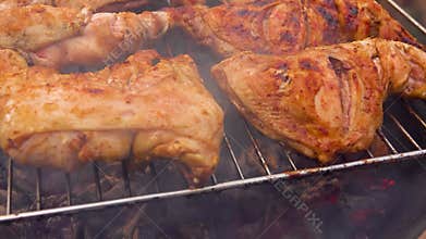 Close Up Panning of Marinated Chicken Thighs Grilling on Charcoal