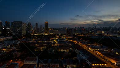 Time lapse of sunset to blue hour over Kampong Glam with Singapore cityscape