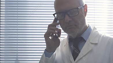 Doctor giving a consultation to a patient on the phone