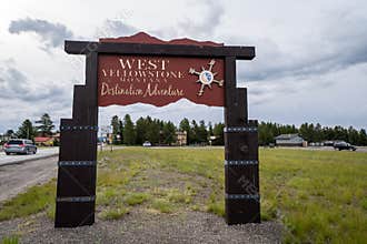 Welcome sign for West Yellowstone MT, a gateway city and community to the popular