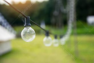 Outdoor string Light bulbs hanging on a line
