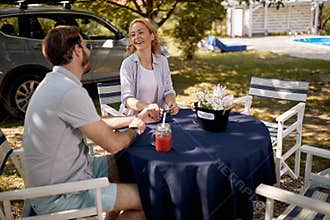 Couple enjoying summer picnic in countryside