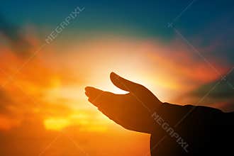 Christian woman praying worship at sunset. Hands folded in prayer. worship god with christian concept religion.