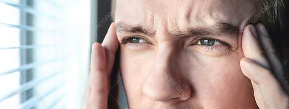 Serious man with stress. Ashamed or depressed person. Burnout, amnesia, memory loss or ptsd concept. Migraine or headache.