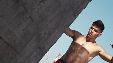 Young male athlete working out with a resistance band