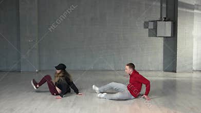 Attractive couple dancing hip-hop.