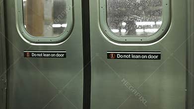 Closing the doors of the train. Subway of New York. Close-up.