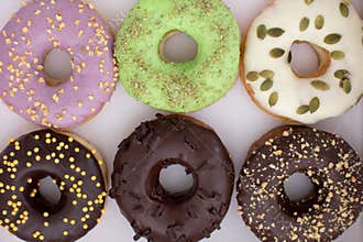 Various donuts lying in box