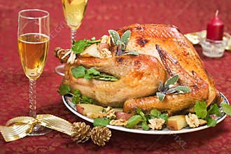 Christmas turkey on holliday table and flute of champagne