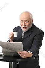 Surprised businessman reading newspaper