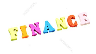 Closeup finger composing Finance word colorful letter 4k Concept footage.