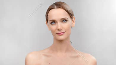 Portrait of smiling European woman with natural beauty perfect skin posing looking at camera