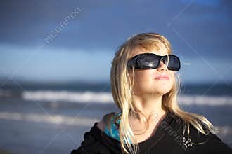 Girl in sunglasses at beach