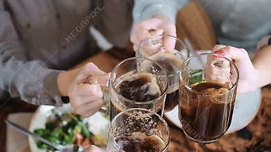 Closeup feast person clink glasses drinking alcohol beverage. Shot on RED Raven Cinema Camera