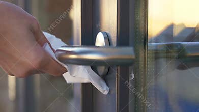 Hand cleaning doorhandle with disinfectant spray