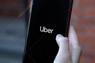New York, USA - 1 May 2020: Uber app logo close-up on phone screen, Illustrative Editorial
