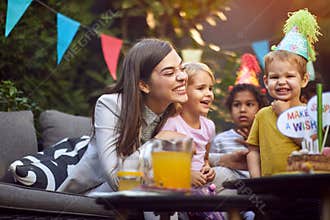 Kids birthday party.Happy family at a birthday party