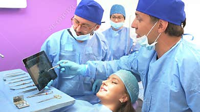 Dental team examining radiography