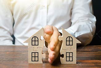 A lawyer shares a house or property between owners. Divorce concept. The division process of real estate and property