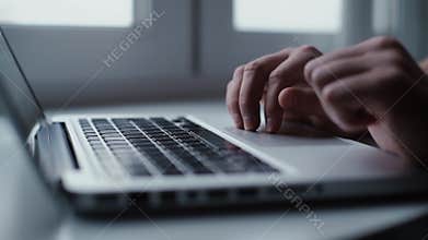 Man opening laptop and starts typing on keyboard of computer, close-up.
