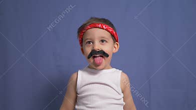 Funny Mexican boy with a big black mustache and a white t shirt