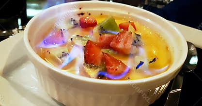 Catalan cream with fruit and flame on