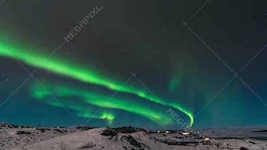 High resolution cinematic time lapse of the northern lights also called as Aurora Borealis over the Iceland in the winter time
