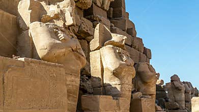 Old Egyptian statue which is made by stone in The Karnak Temple Complex, Luxor, Egypt