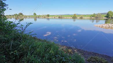 View of the Danube, a river that flows through Bavaria with fields and meadows on the banks