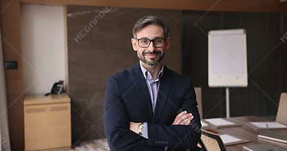 Middle aged 40s Portuguese male employee portrait