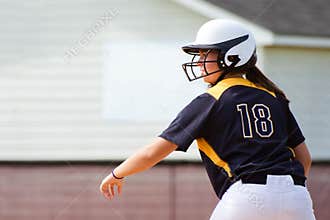 Teen girl playing softball
